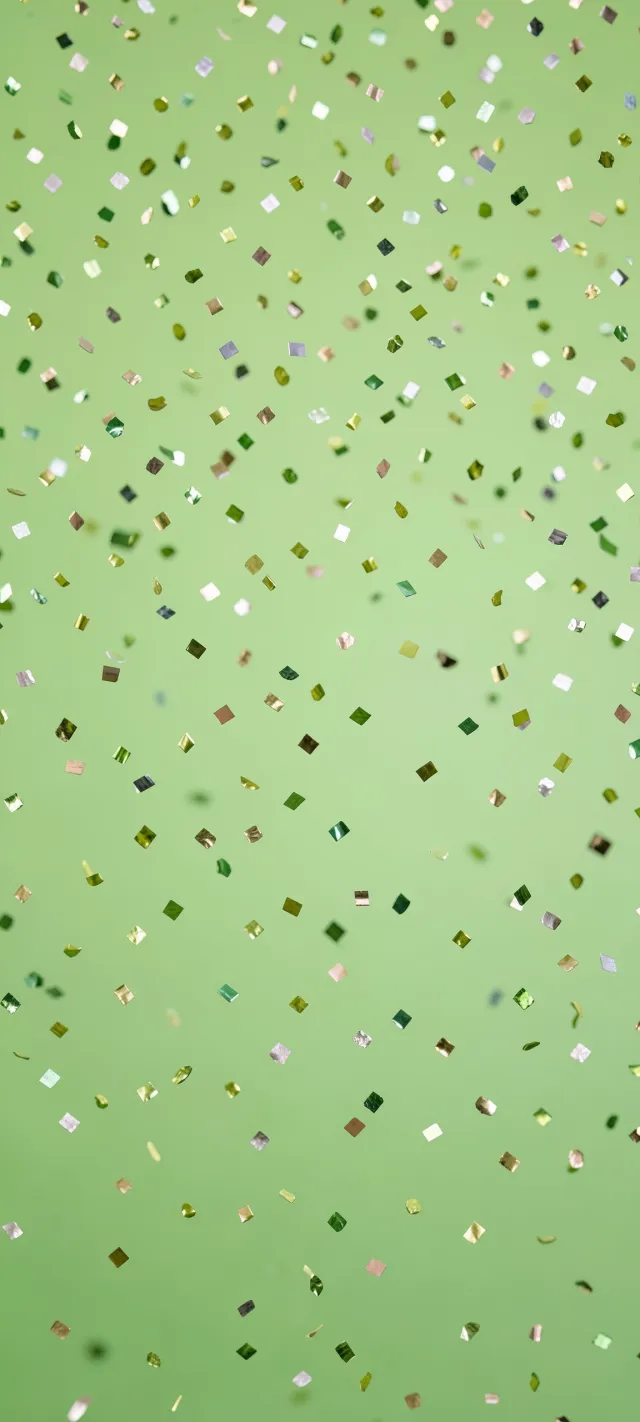 Floating Metallic Confetti on Green